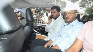 Arvind Kejriwal in a car leaving for Tihar Jail